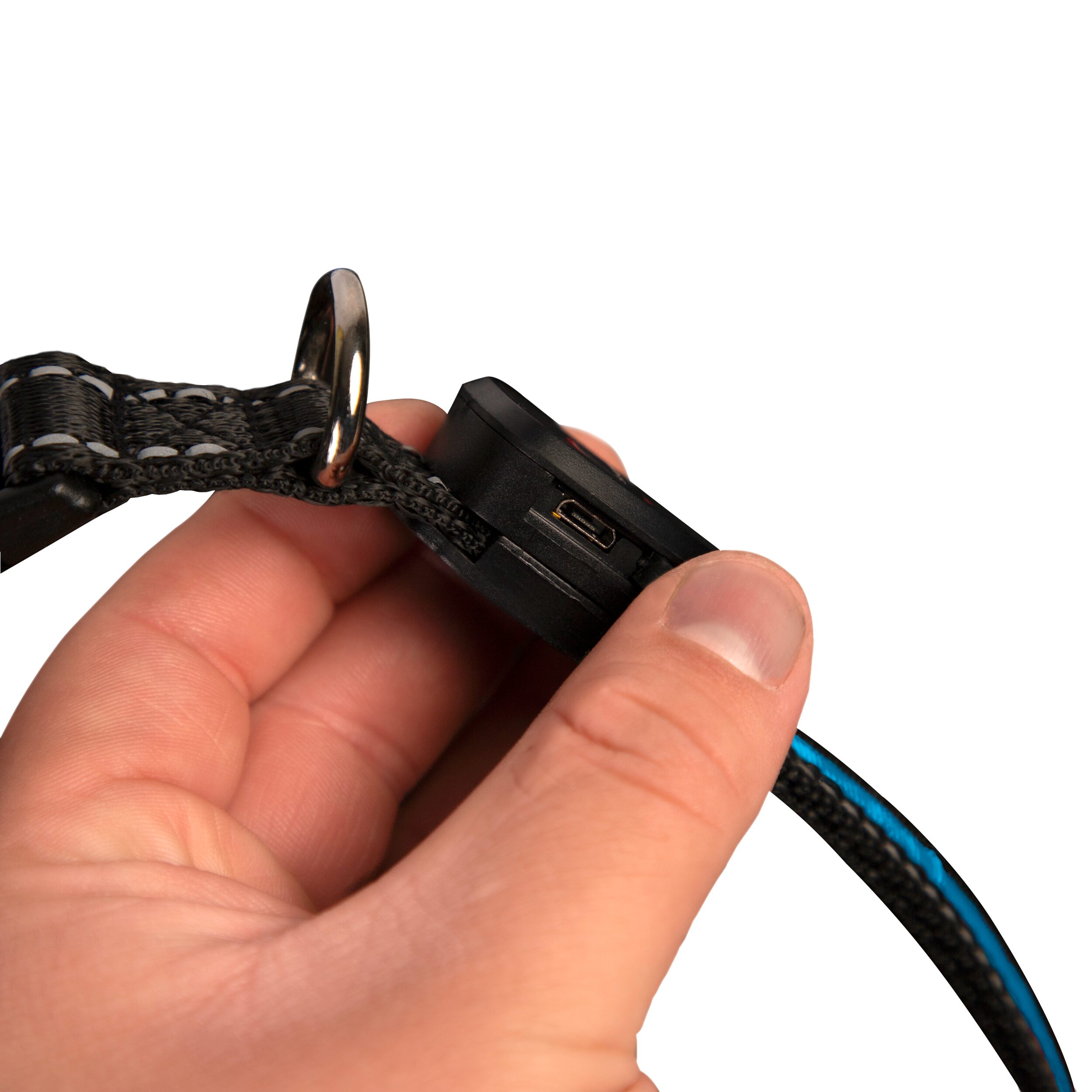 Close-up of a hand holding a black braided strap with a metal hook and a small black plastic connector.