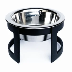 Close-up of a cylindrical outdoor light fixture with a chrome reflector and black metal frame.