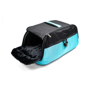 Close-up of a turquoise and black pet carrier bag with a mesh top and soft fur-lined interior, angled to show opening.