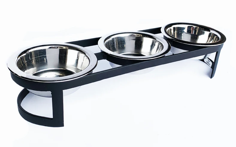 Triple stainless steel bowls held in a black elevated pet feeder stand for easy feeding access.