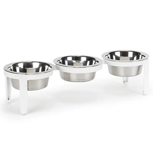 Three stainless steel pet bowls on a white elevated stand, for feeding pets.